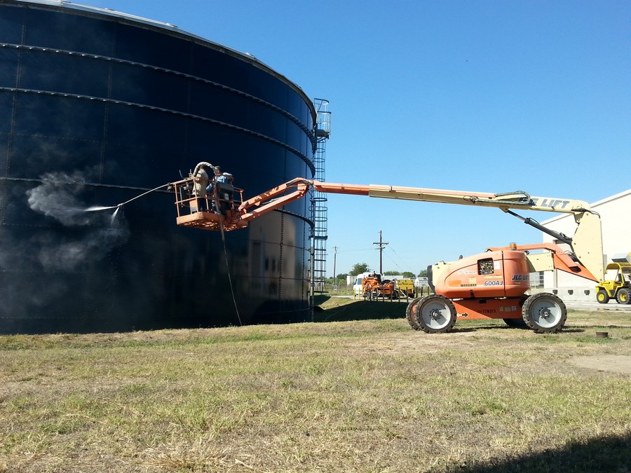 water blast of potable water storage tan