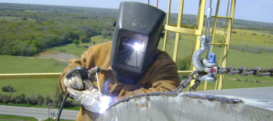weld repair of a stainless steel hood 168ft above ground level